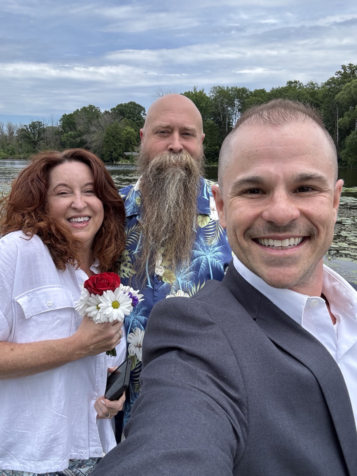 Officiant selfie with couple at lakeside elopement in Wisconsin